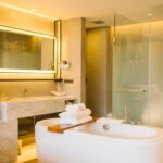 luxury-bathtub-inside-bedroom-hotel_1150-10837
